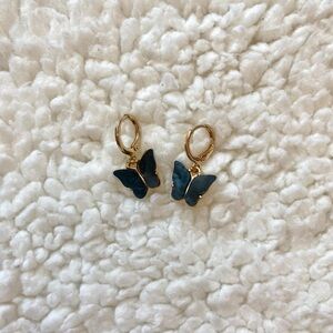 Gold mini hoops with black butterfly charms